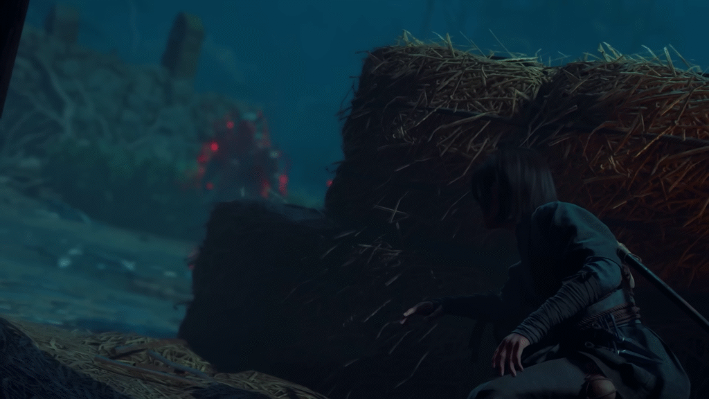 A cloaked warrior crouches behind a haystack in a dark, eerie forest while a glowing red enemy looms in the distance, partially obscured by mist and trees. The scene is tense, with the character ready to draw their sword at any moment.